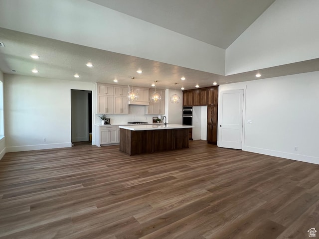 1148 N 1875 E Unit 2, Layton, UT 84040 - kitchen featuring open floor plan, light countertops, a center island with sink, dark wood-style flooring, and recessed lighting