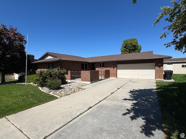 281 N Pin Oak Cir, Kaysville, UT 84037 - single story home with an attached garage, concrete driveway, brick siding, and a front yard