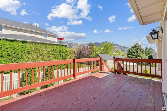 wooden deck with a mountain view