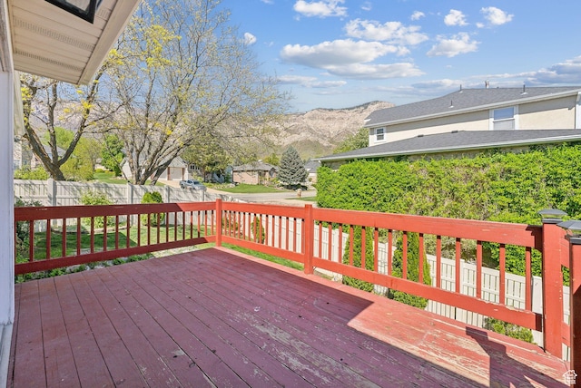wooden terrace with a mountain view and fence