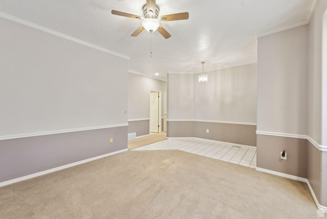 tiled empty room with carpet flooring, visible vents, baseboards, and ceiling fan with notable chandelier