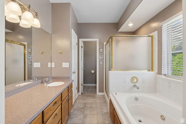 bathroom featuring vanity, baseboards, a jetted tub, and a stall shower