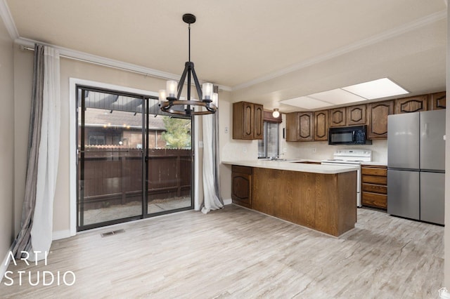 1314 E 1990 S, Ogden, UT 84401 - kitchen with freestanding refrigerator, crown molding, visible vents, electric stove, and black microwave