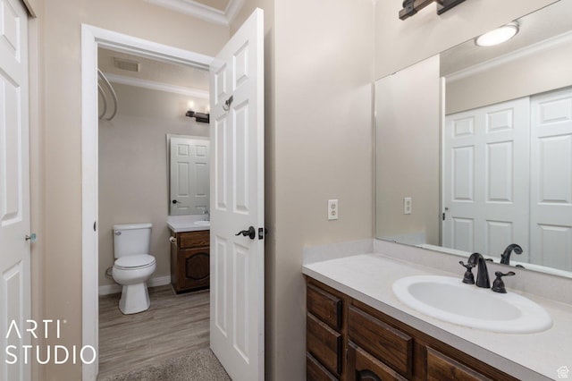1314 E 1990 S, Ogden, UT 84401 - bathroom featuring toilet, wood finished floors, crown molding, visible vents, and vanity