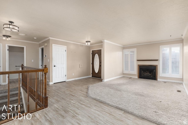 1314 E 1990 S, Ogden, UT 84401 - unfurnished living room with a fireplace with flush hearth, wood finished floors, baseboards, and ornamental molding