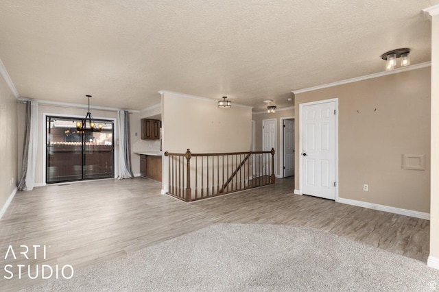 1314 E 1990 S, Ogden, UT 84401 - spare room with light wood finished floors, a textured ceiling, and ornamental molding