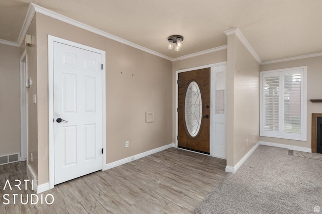 1314 E 1990 S, Ogden, UT 84401 - foyer entrance featuring crown molding, visible vents, and baseboards
