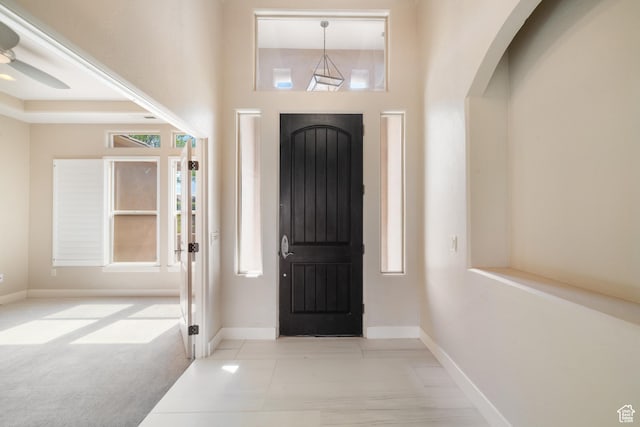 2996 S Limestone Dr, St George, UT 84790 - tiled foyer entrance featuring a towering ceiling, baseboards, and arched walkways
