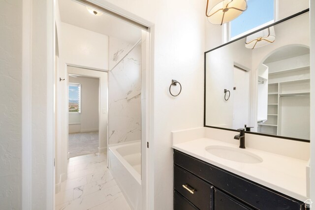 2996 S Limestone Dr, St George, UT 84790 - full bathroom featuring marble finish floor, vanity, and a healthy amount of sunlight