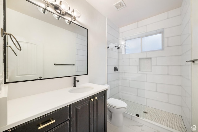 2996 S Limestone Dr, St George, UT 84790 - full bath featuring toilet, marble finish floor, visible vents, a tile shower, and vanity