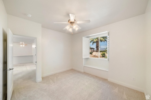 2996 S Limestone Dr, St George, UT 84790 - spare room featuring light colored carpet, baseboards, and a ceiling fan