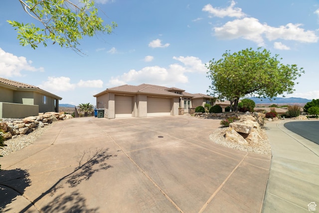 2996 S Limestone Dr, St George, UT 84790 - prairie-style home with driveway, stucco siding, and an attached garage