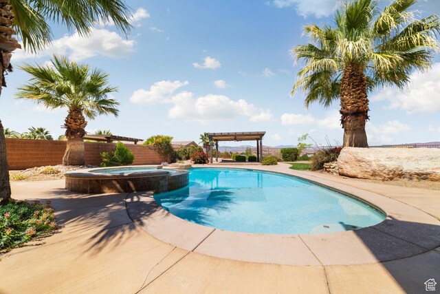 2996 S Limestone Dr, St George, UT 84790 - view of swimming pool featuring a fenced backyard, a pergola, a patio, and a pool with connected hot tub