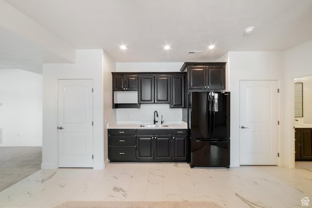 2996 S Limestone Dr, St George, UT 84790 - kitchen with freestanding refrigerator, marble finish floor, visible vents, a sink, and light countertops