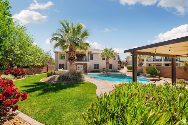2996 S Limestone Dr, St George, UT 84790 - view of swimming pool featuring a yard, a fenced backyard, a patio, and a pool with connected hot tub