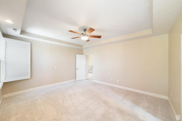 2996 S Limestone Dr, St George, UT 84790 - carpeted spare room with a tray ceiling, baseboards, and a ceiling fan