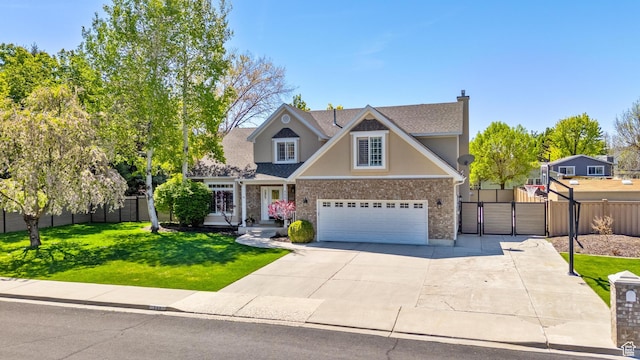 view of front of house with a gate, fence, driveway, a garage, and a front lawn