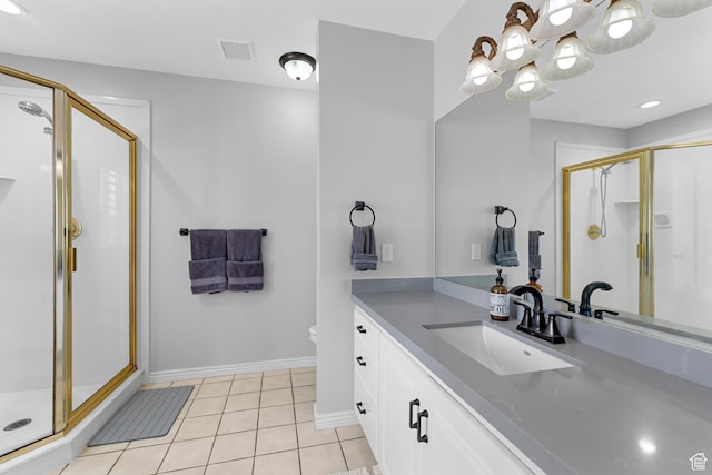 full bath featuring a stall shower, a chandelier, and tile patterned flooring