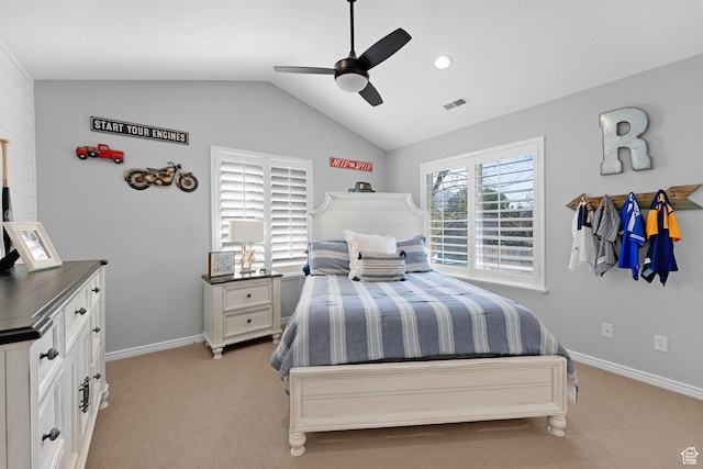 bedroom with light colored carpet, visible vents, vaulted ceiling, ceiling fan, and baseboards