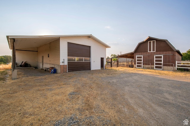 105 S 400 E, Hyde Park, UT 84318 - garage featuring fence and a garage