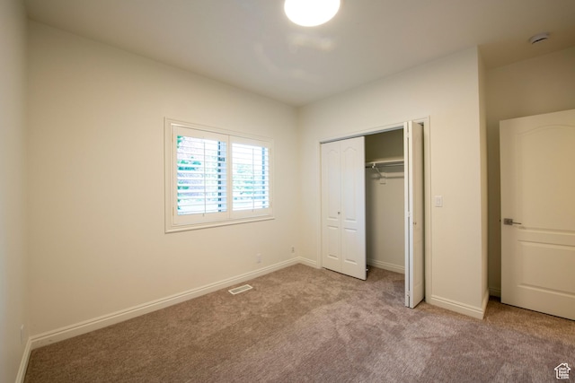 105 S 400 E, Hyde Park, UT 84318 - unfurnished bedroom featuring carpet floors, baseboards, visible vents, and a closet