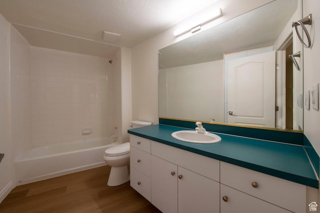 105 S 400 E, Hyde Park, UT 84318 - full bathroom with toilet, visible vents, vanity, shower / washtub combination, and wood finished floors
