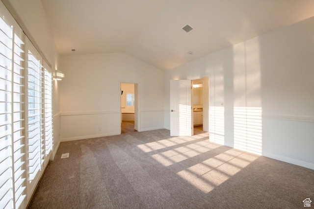 105 S 400 E, Hyde Park, UT 84318 - unfurnished bedroom with lofted ceiling, carpet, baseboards, and multiple windows