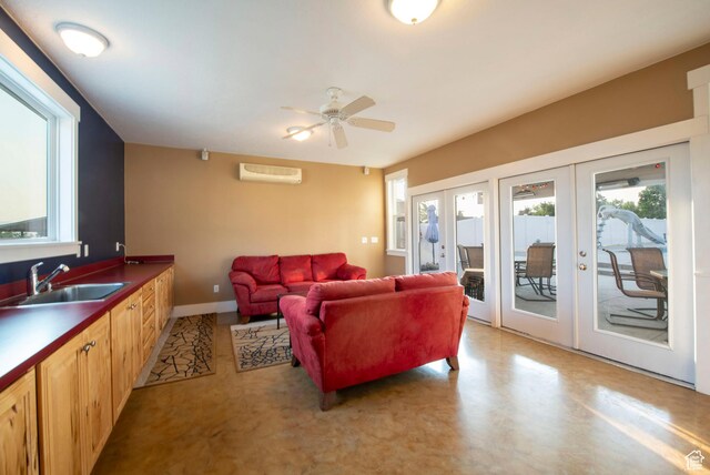 105 S 400 E, Hyde Park, UT 84318 - living area with a wall mounted air conditioner, french doors, and ceiling fan