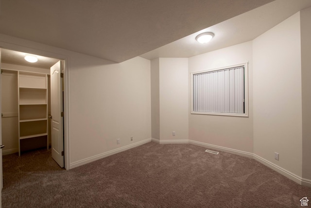 105 S 400 E, Hyde Park, UT 84318 - unfurnished bedroom with carpet, baseboards, and a walk in closet