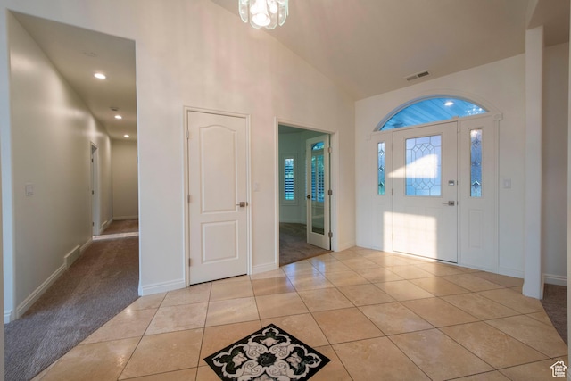 105 S 400 E, Hyde Park, UT 84318 - entrance foyer featuring light tile patterned floors, baseboards, visible vents, and high vaulted ceiling