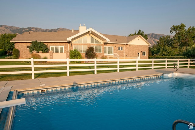 105 S 400 E, Hyde Park, UT 84318 - view of swimming pool featuring a yard, fence private yard, a fenced in pool, and a mountain view