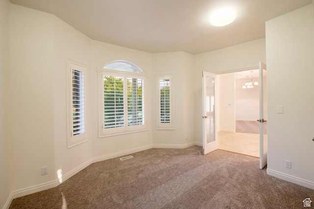 105 S 400 E, Hyde Park, UT 84318 - empty room with carpet, visible vents, baseboards, and a notable chandelier