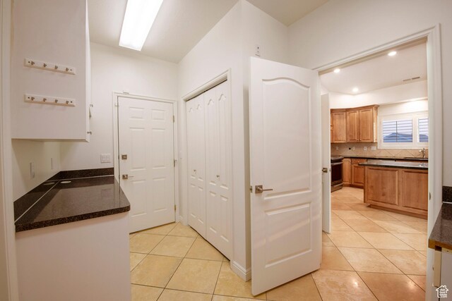 105 S 400 E, Hyde Park, UT 84318 - hall with a sink, light tile patterned floors, and recessed lighting