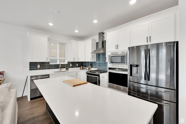 1281 Village Green Trl, Park City, UT 84098 - kitchen with wall chimney range hood, light countertops, stainless steel appliances, and a sink