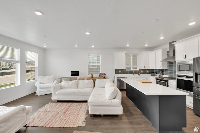 1281 Village Green Trl, Park City, UT 84098 - kitchen featuring a sink, open floor plan, decorative backsplash, wall chimney exhaust hood, and stainless steel appliances