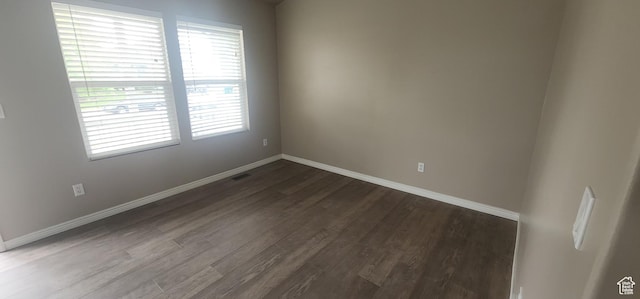 3391 W 1125 N, Layton, UT 84040 - empty room with dark wood-style floors, baseboards, and healthy amount of natural light