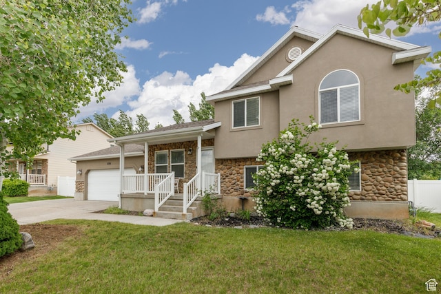 3391 W 1125 N, Layton, UT 84040 - tri-level home featuring stone siding, concrete driveway, an attached garage, and stucco siding