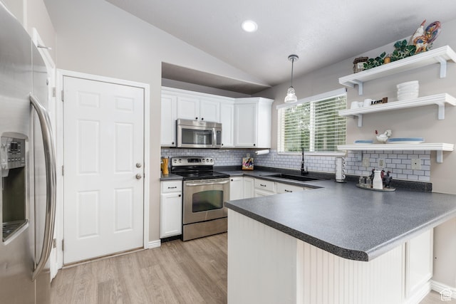 3391 W 1125 N, Layton, UT 84040 - kitchen with stainless steel appliances, a sink, dark countertops, tasteful backsplash, and vaulted ceiling