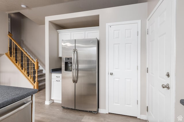 3391 W 1125 N, Layton, UT 84040 - kitchen with stainless steel appliances, light wood-style floors, white cabinetry, and baseboards