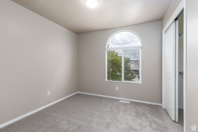 3391 W 1125 N, Layton, UT 84040 - unfurnished bedroom with light colored carpet, a closet, and baseboards
