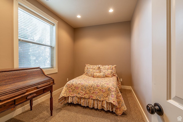 carpeted bedroom with baseboards and recessed lighting