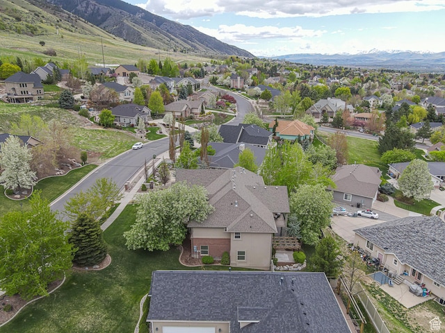 birds eye view of property featuring a mountain view and a residential view