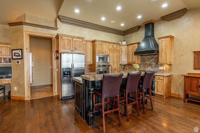 kitchen with dark wood-style floors, stainless steel appliances, premium range hood, and a kitchen island with sink