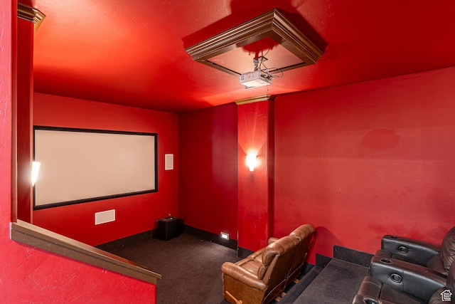 cinema featuring baseboards and carpet flooring