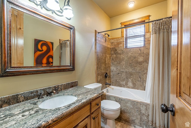 full bathroom with toilet, tiled shower / bath, and vanity