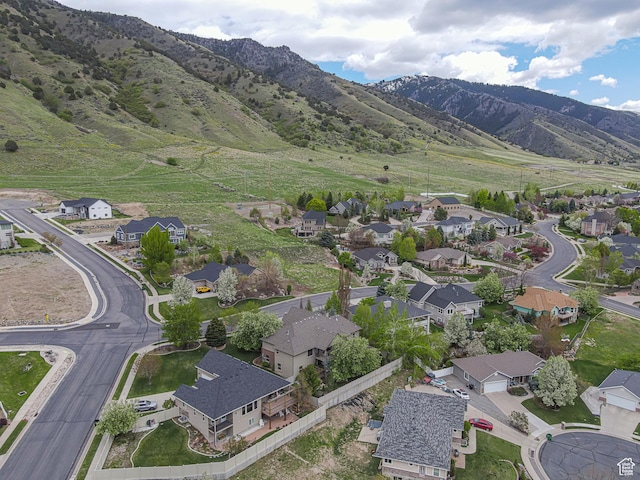 birds eye view of property featuring a mountain view and a residential view