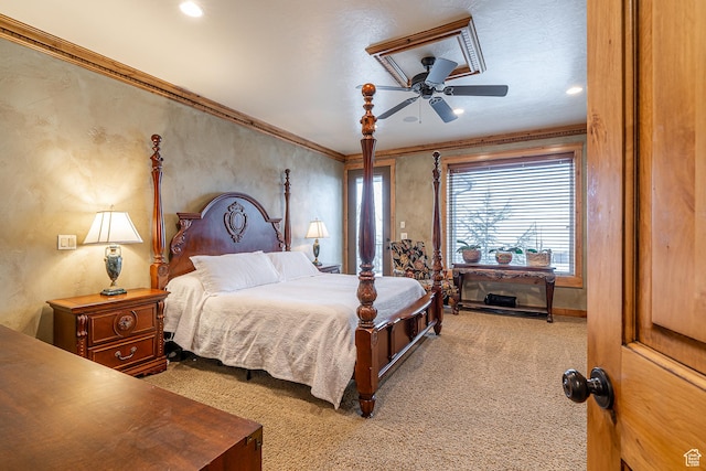 bedroom with ornamental molding and carpet flooring