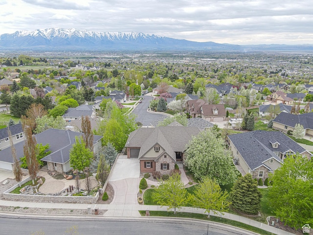 birds eye view of property featuring a mountain view and a residential view