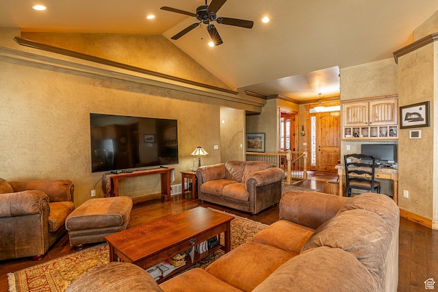 living room with lofted ceiling, wood-type flooring, a ceiling fan, and a textured wall
