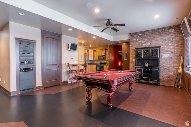 rec room with a ceiling fan, recessed lighting, baseboards, brick wall, and billiards